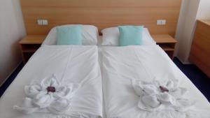 Voodi või voodid majutusasutuse Hotel O.K. 1 toas