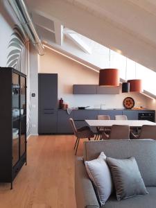 a living room with a couch and a table at AR Boutique Apartments in Bergamo