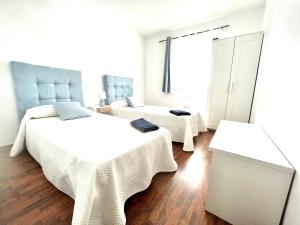 Posteľ alebo postele v izbe v ubytovaní FTV Holidays Homes
