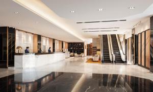 a lobby of a building with a bar in it at Amari Don Muang Airport Bangkok in Bangkok