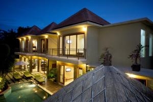 a villa with a swimming pool at night at O Villas Seminyak - 2026 Earlybirds ON SALE! in Seminyak