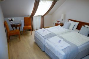 Postel nebo postele na pokoji v ubytování Barkóscinege Vendégház + 16 fotografií