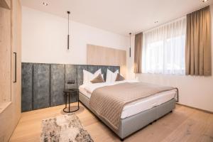 Postel nebo postele na pokoji v ubytování Die Zillertalerin