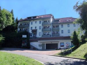 a large white building on the side of a road at Fewo 6 - Residenz Schauinsland - mit Sauna, Todtnauberg, bei Feldberg in Todtnauberg