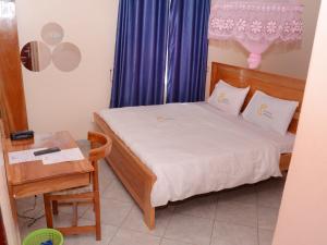 Ένα ή περισσότερα κρεβάτια σε δωμάτιο στο CS HOTEL