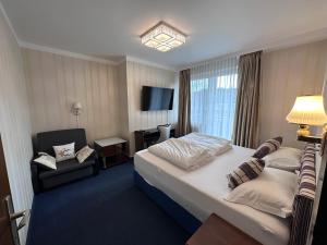 Postel nebo postele na pokoji v ubytování Hotel Austria
