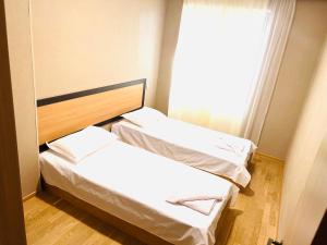 Ένα ή περισσότερα κρεβάτια σε δωμάτιο στο Green Hotel ANG