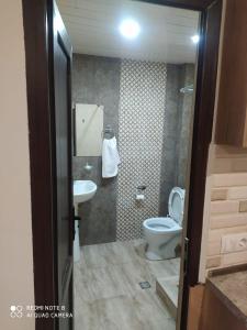 a bathroom with a toilet and a sink at ГудиВуди in Tsaghkadzor