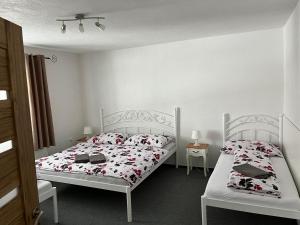 Postel nebo postele na pokoji v ubytování A&A Apartmany