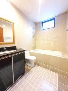 a bathroom with a sink and a tub and a toilet at [HERITAGE 3] HOMESTAY Studio 4Pax, FREE WIFI NETFLIX in Seri Kembangan