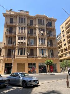 a car parked in front of a building at Berlin Hotel in Cairo