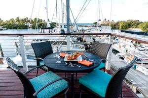 a table with a plate of food on a boat at New! Bluestone Getaway in Christiansted USVI ! in Christiansted