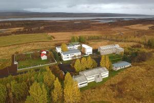 an aerial view of a house in a field at Eiðar - Hostel in Eiðar