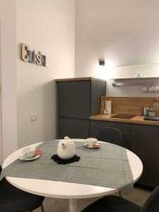 a kitchen with a table with a tea pot on it at apartment rent Casa ALMIKA in Bari