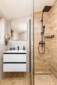 a bathroom with a sink and a shower at wine house apartments& rooms Marčeta in Fažana