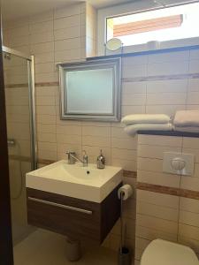 Koupelna v ubytování Une-max