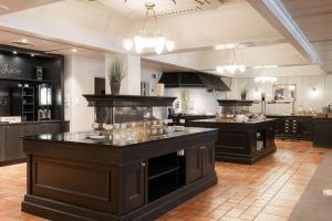 a large kitchen with a large island in a room at Scandic Valdres in Fagernes