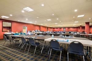 a classroom with tables and chairs in a room at Quality Inn and Suites Fairgrounds - Syracuse in Liverpool
