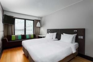 Postel nebo postele na pokoji v ubytování Radisson Blu Hotel Espoo