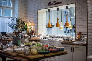 a kitchen with a counter with dishes on it at The Vault Hotel, WorldHotels Crafted in Helsingborg