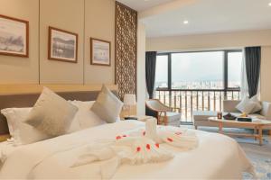 Postel nebo postele na pokoji v ubytování White Swan Guest House MeiZhou + 37 fotografií