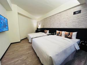 Voodi või voodid majutusasutuse Home Rest Hotel toas