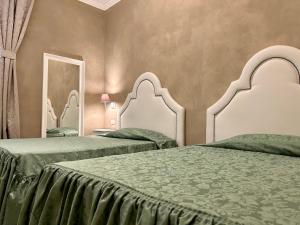 Postel nebo postele na pokoji v ubytování Boutique Hotel Calais Milano + 37 fotografií