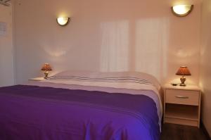 Ένα ή περισσότερα κρεβάτια σε δωμάτιο στο Hôtel Timgad
