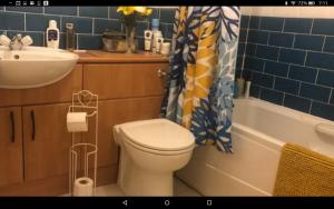 a bathroom with a toilet and a sink and a tub at Dundee City Waterfront, 2 Bedroom 2 Bathroom Apartment - short walk to V and A, Bus & Train Stations in Dundee