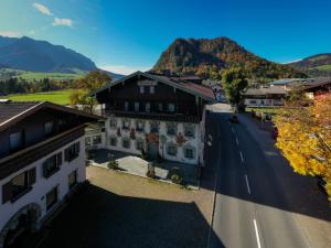 an aerial view of a building on a street at Hotel Walchseer Hof in Walchsee