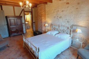 Postel nebo postele na pokoji v ubytování Clos de la Dîme