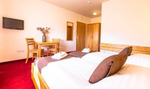 Postel nebo postele na pokoji v ubytování B&B Bau