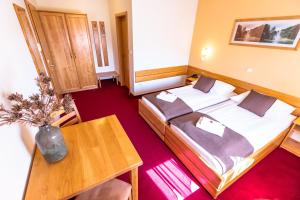 Postel nebo postele na pokoji v ubytování B&B Bau