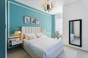 Postel nebo postele na pokoji v ubytování AYA Boutique - Jumeirah Gate Tower 1
