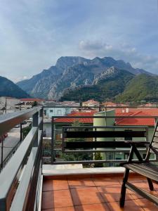 a balcony with a bench and a view of mountains at Guesthouse Alexandros in Pýli