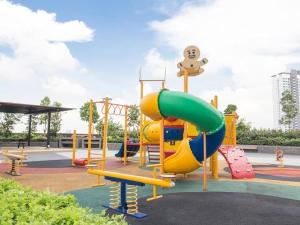a playground with a slide in a park at Platino, beside Paradigm Shopping Mall, free wi-fi, 4 bedrooms & 3 toilets, up to 12pax in Johor Bahru