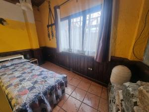 מיטה או מיטות בחדר ב-BAJOS CON ENCANTO EN RIALP