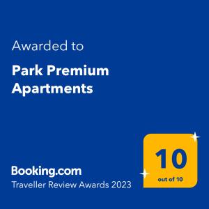a yellow sign that sayspared to park premium apartments at Park Premium Apartments in Birštonas