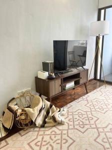 A television and/or entertainment centre at lily maison