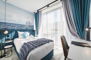 Voodi või voodid majutusasutuse Hotel Aurel Coast toas