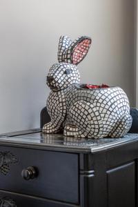 a rabbit statue sitting on top of a dresser at Althaia Pension in Nafplio