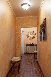 a hallway with two chairs and a table at Althaia Pension in Nafplio