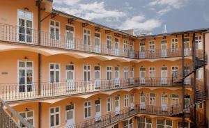 an external view of a building with balconies at Hotel Patio Prague in Prague