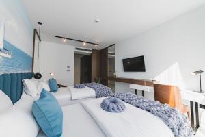 Voodi või voodid majutusasutuse Hotel Aurel Coast toas