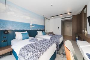 Voodi või voodid majutusasutuse Hotel Aurel Coast toas