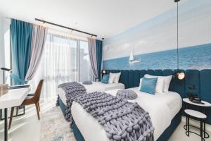 Voodi või voodid majutusasutuse Hotel Aurel Coast toas