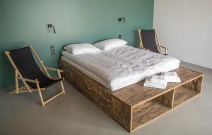 Cama ou camas em um quarto em Wakepond atostogų slėnis