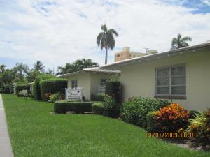 a house with a sign in the yard at The Grove in Delray Beach