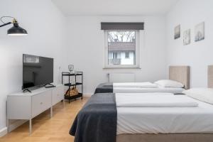 Postel nebo postele na pokoji v ubytování CASSEL LOFTS - Gehobene Monteurwohnung für 4 - nähe Uni, Klinikum, Industriepark Mittelfeld
