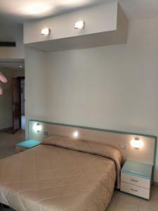 Postel nebo postele na pokoji v ubytování Hotel Ala Bianca